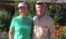 Dick and Gay Sise Grossman ’65 standing in front of flowers